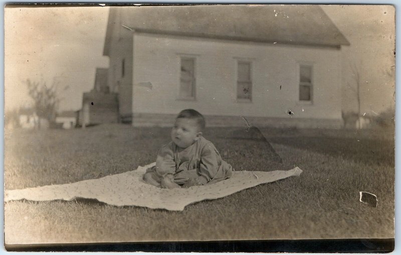 c1910s Cute Baby Outdoors RPPC Blanket House Yard Play Real Photo Postcard A173