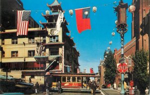 United States California San Francisco Chinatown Grant Avenue flags cable car