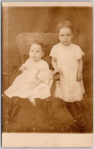 Infant Sits on Chair Toddler Stands Besides Children Photograph RPPC Postcard