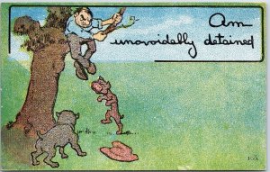VINTAGE POSTCARD AM UNAVOIDABLY DETAINED DOGS BARKING MAN UP TREE c. 1910