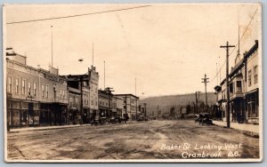 Postcard RPPC c1910s Cranbrook BC Baker St. View Looking West Old Cars Shops