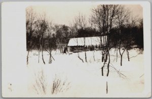 Snow Covered Small Cabin with Frozen Ice, Deer and Bear Rack - Vintage Postcard