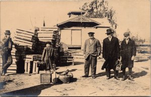 Real Photo Postcard Men with Suitcase and Crates Possibly Railroad Depot~3366