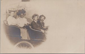 RPPC Postcard Women + Men With Hats Driving in Car