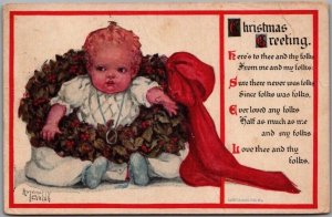 1900s CHRISTMAS GREETING Postcard BABY in WREATH Artist Antionette Clark Creased 