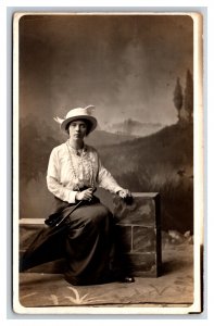 RPPC Attractive Woman Studio View Sitting on Prop Brick Wall Postcard U3