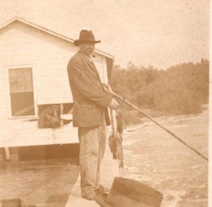 RPPC Man Smoking Pipe Fishing From Bulkhead UNP  Postcard W14