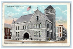 c1920s Car and US Flag Scene, Post Office Jackson Michigan Posted Postcard 