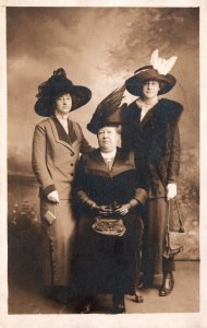 VINTAGE POSTCARD TWO SISTERS AND MOTHER IN REAL PHOTO POSE ON BOARDWALK c. 1910