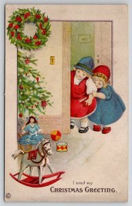 Christmas Children Peak At Toys Doll Rocking Horse Tree Wreath Postcard U26