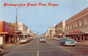 Grants Pass Oregon Greetings From scene of business district vintage pc Y7441