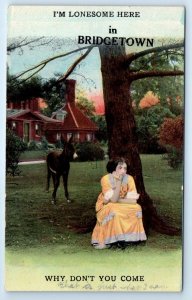 'I'm Lonesome in BRIDGETOWN' Woman & Donkey under tree NS CANADA Postcard