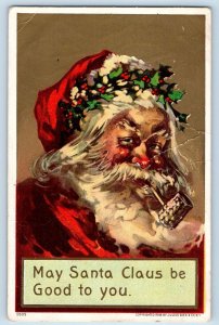 Christmas Postcard Santa Claus With Pipe Holly Berries Embossed Finley ND 1910