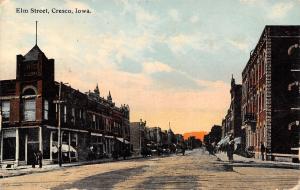 Cresco Iowa~Elm Street Businesses~Men on Corner~1914 Postcard