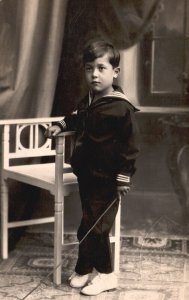 Vintage Postcard Young Boy in Sailors Uniform White Shoes Portrait Real Photo