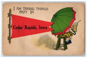 c1910 I Am Takings Things East Girl Umbrella Cedar Rapids Iowa Pennant Postcard