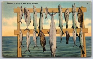 Key West Florida~Fishing Scene~Fish Hanging On Board~Ocean~Linen 1947 Postcard