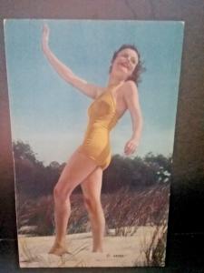 Postcard  Woman in a Bathing Suit in the Sand Dunes