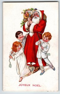 Santa Claus Christmas Postcard Holds Toys As Children Ties Up Saint Nick 1920