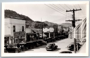 Postcard RPPC Oliver British Columbia Street View Shops Signs Old Cars