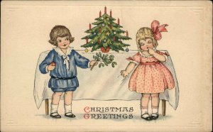 CHRISTMAS Little Boy and Girl at Miniature Tree c1910 Postcard