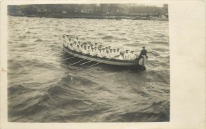 WWI Postcard 30 Sailors Rowing RPPC Troop Transport? German?