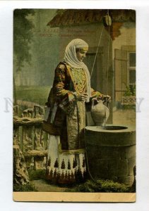 3144558 GREECE woman in native dress well Vintage postcard