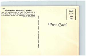 Postcard AK Skagway 1950's Old Cars Street View Chevron Gas Dirt Street G15