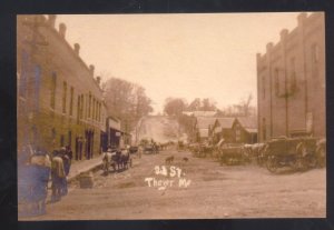 REAL PHOTO THAYER MISSOURI DOWNTOWN STREET SCENE DIRT ROAD POSTCARD