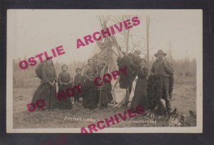 Minnesota RPPC c1910 INDIAN VILLAGE Tepee CHRISTMAS GREENS HARVEST Chippewa? MN