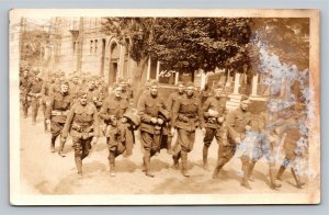 RPPC U.S. Army Soldiers Walking Str African American Woman Watch WWI Real Photo 