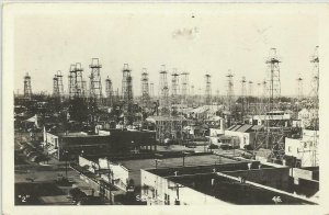 rppc - TEXAS - KILGORE - SKYLINE - OIL DERRICKS & BUILDINGS - CIRCA 1950