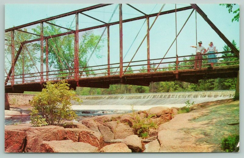 Keshena Wisconsin~Bridge Crossing Wolf River~Boulders~People on Bridge~1950s