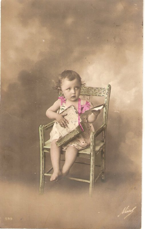 Little girl sitting in chair Old vintage antiue postcard