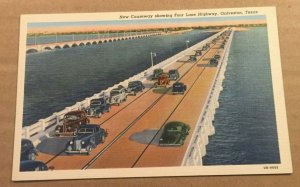 VINT. UNUSED .01 LINEN POSTCARD - NEW CAUSEWAY FOUR LANE HWY., GALVESTON, TEXAS