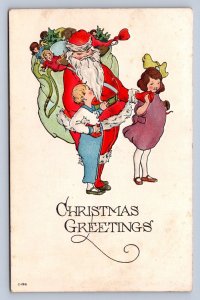 J87/ Santa Claus Christmas Postcard c1910 Children Toys Hug 249