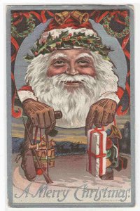 Santa Holding Gifts Christmas 1912 postcard