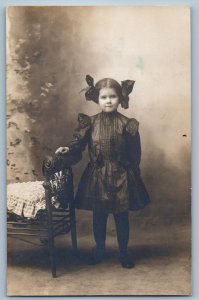 c1910's Cute Child Girl Black Dress Portrait Studio RPPC Photo Antique Postcard