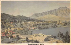 RPPC QUEENSTOWN NEW ZEALAND HAND COLORED REAL PHOTO POSTCARD (c. 1920s)