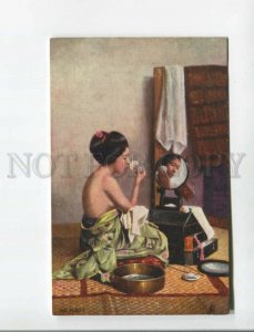 472766 Semi-nude japanese geisha girl putting on make-up in front a mirror TUCK