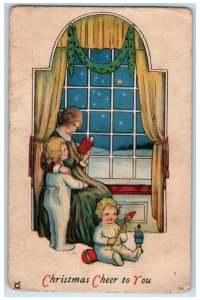 Christmas Postcard Mother And Children On Window Winter Scene 1924 Vintage