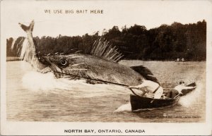 North Bay Ontario Exaggerated Fish Fishermen 'We Use Big Bait Here' Postcard F94