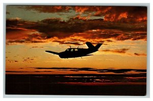 Vintage 1960's Advertising Postcard The Beechcraft Bonanza in Flight at Sunset