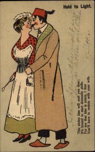 Comic Hold to Light HTL Romance Kissing Mother-in-Law Appears c1905 Postcard