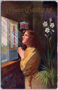 VINTAGE POSTCARD EASTER GREETING WOMAN PRAYING BESIDE WINDOW POSTED 1909