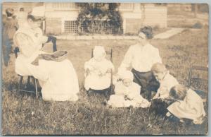 BABYSITTING 1907 ANTIQUE REAL PHOTO POSTCARD RPPC w/ CORK CANCEL