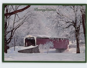 Postcard All Seasons A wintery covered bridge in rural Pennsylvania USA