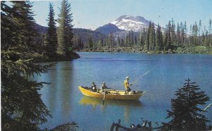 Fishing on Sparks Lake Three Sister Mountains in Background Oregon