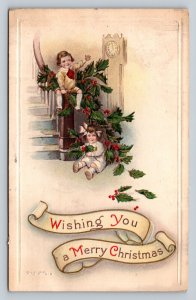 c1916 Children Near Banister Covered in Gold Trimmed Holly ANTIQUE Postcard 1080