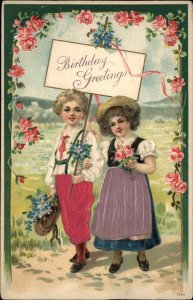 BIRTHDAY GREETINGS Little Boy and Girl REAL SILK CLOTHING c1910 Postcard